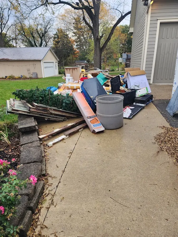 Dumpster being loaded with debris for 12 Yard Dumpster Rental in Elizabethtown
